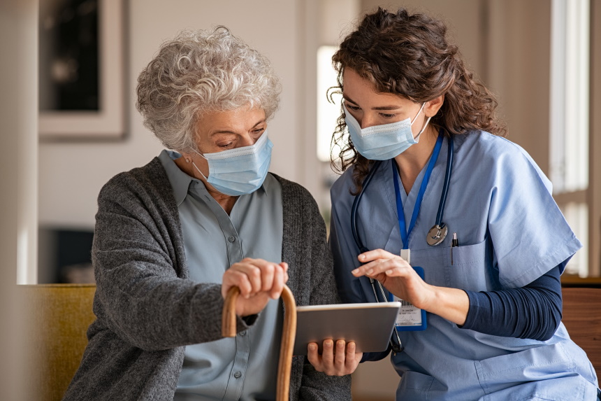 Professional caregiver conducting quality care assessment in client's home